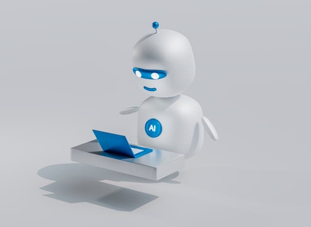 Un robot blanc aux yeux bleus devant un ordinateur portable